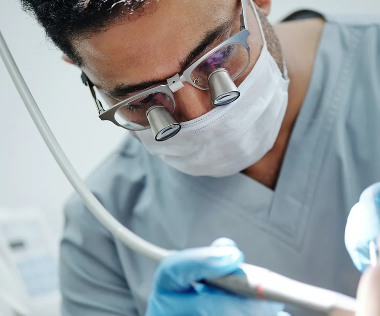 A dentist in Hampstead is performing a root canal on a patient's teeth.